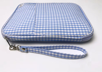 Juliette Watercolor Clutch angled view with wristlet strap and label